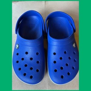 Blue Crocs in Excellent condition . Men size 6 women size 8